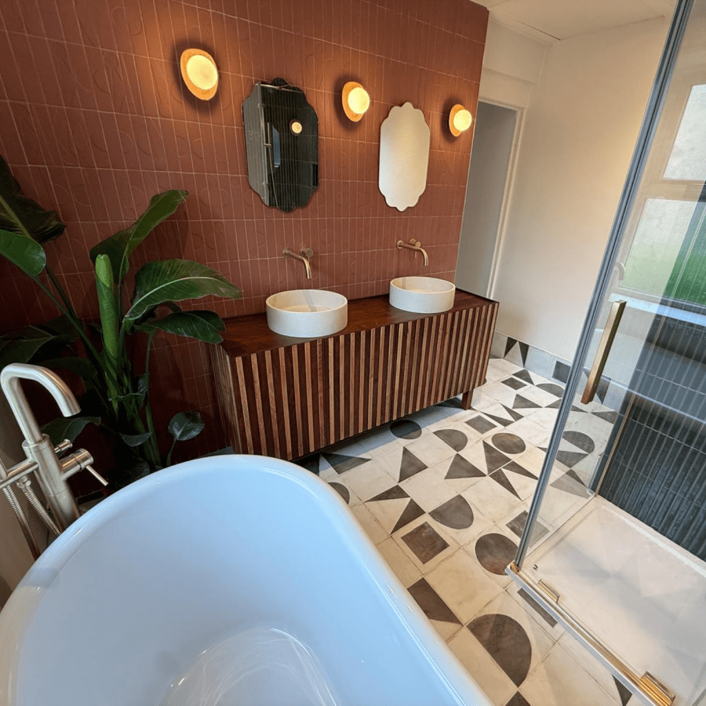 Luxury bathroom in Huddersfield with handmade pink Italian tiles, double basins and bespoke wooden vanity unit