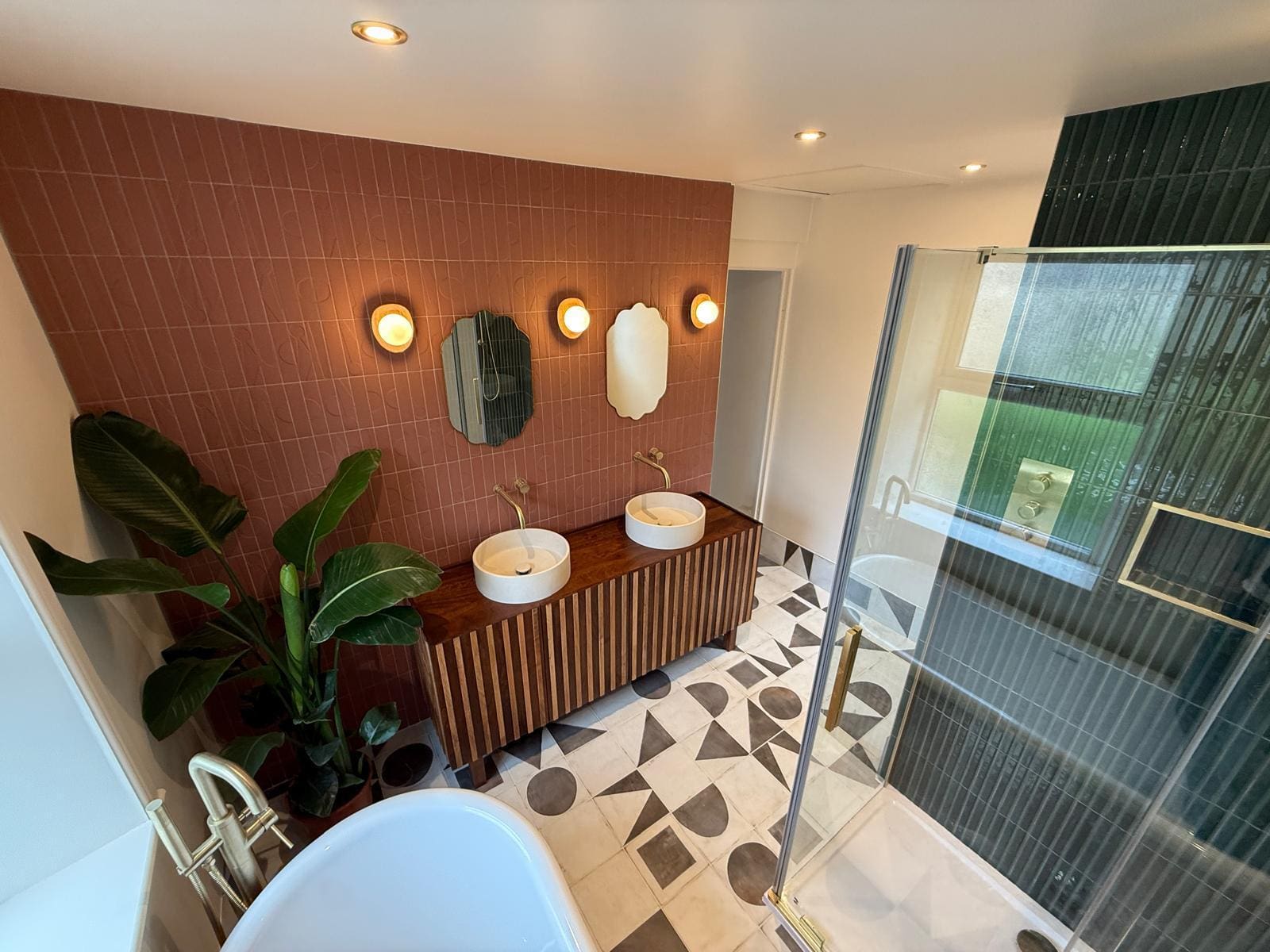 Contemporary bathroom design with walk-in shower, pink Italian tiles and premium brassware fittings